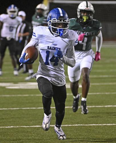 West Feliciana's Adla Washington (14) runs the ball before the stop against Plaquemine, Friday, November 4, 2022 at Plaquemine High School in Plaquemine, LA. 