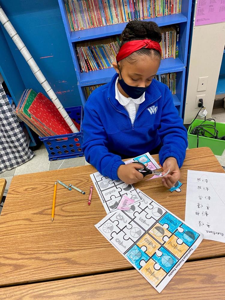 Jigsaw puzzles help students learn fractions at Bains Elementary