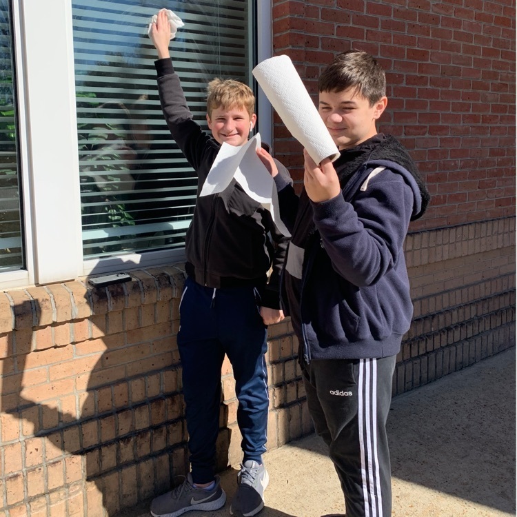 Students clean windows  