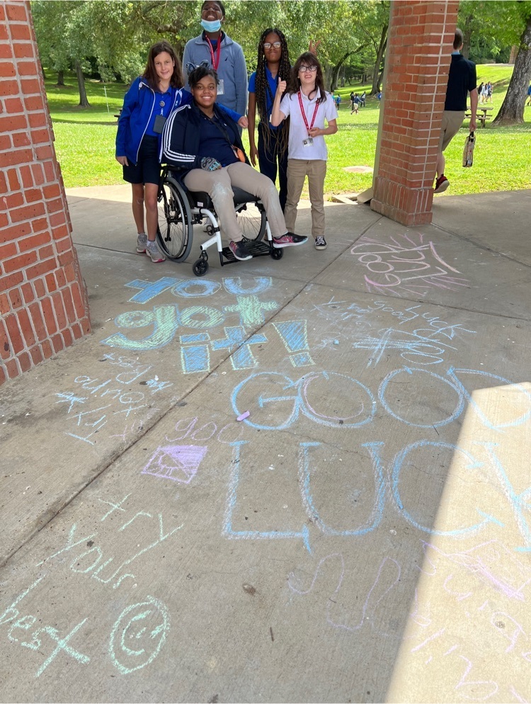 PE students wrote encouraging messages on the sidewalk for LEAP