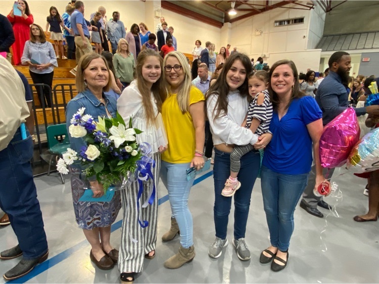 8th grade students celebrate with friends and family  