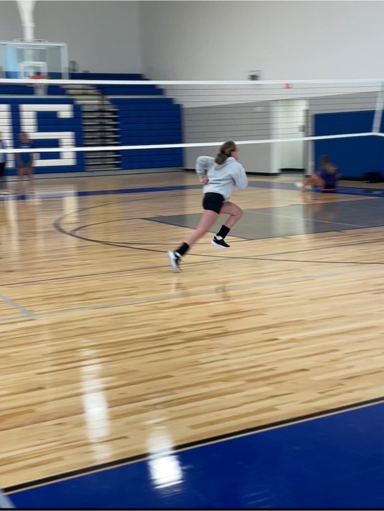Students practice volleyball skills