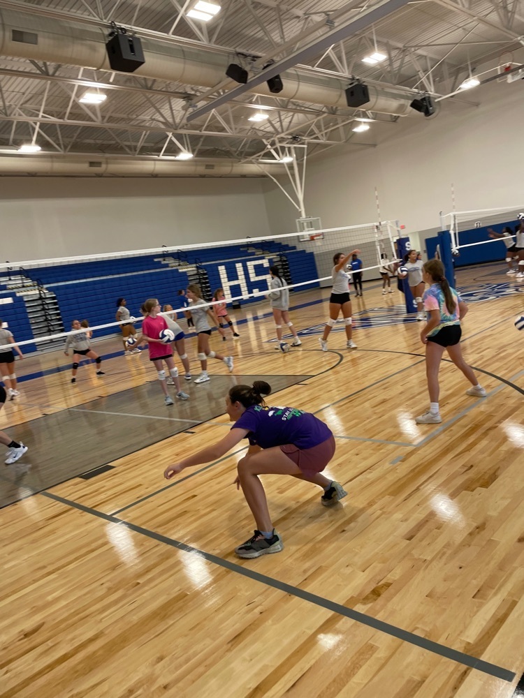Girls practice at the volleyball clinic  