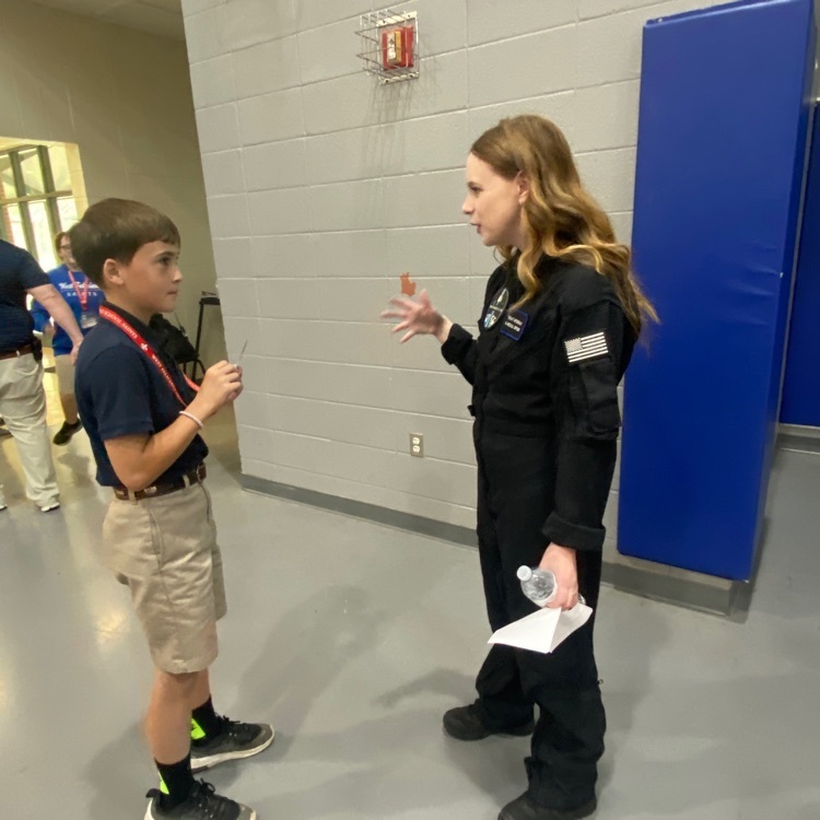 Hayley speaks with a student  