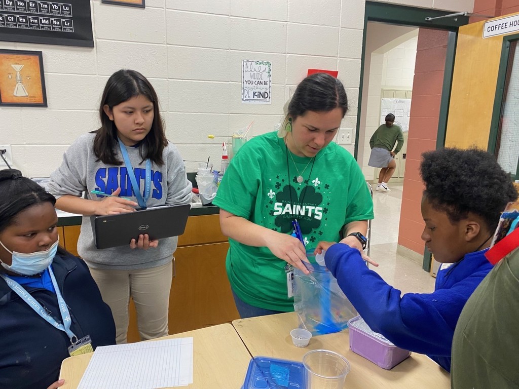 Teacher follows student directions to create chemical reaction.