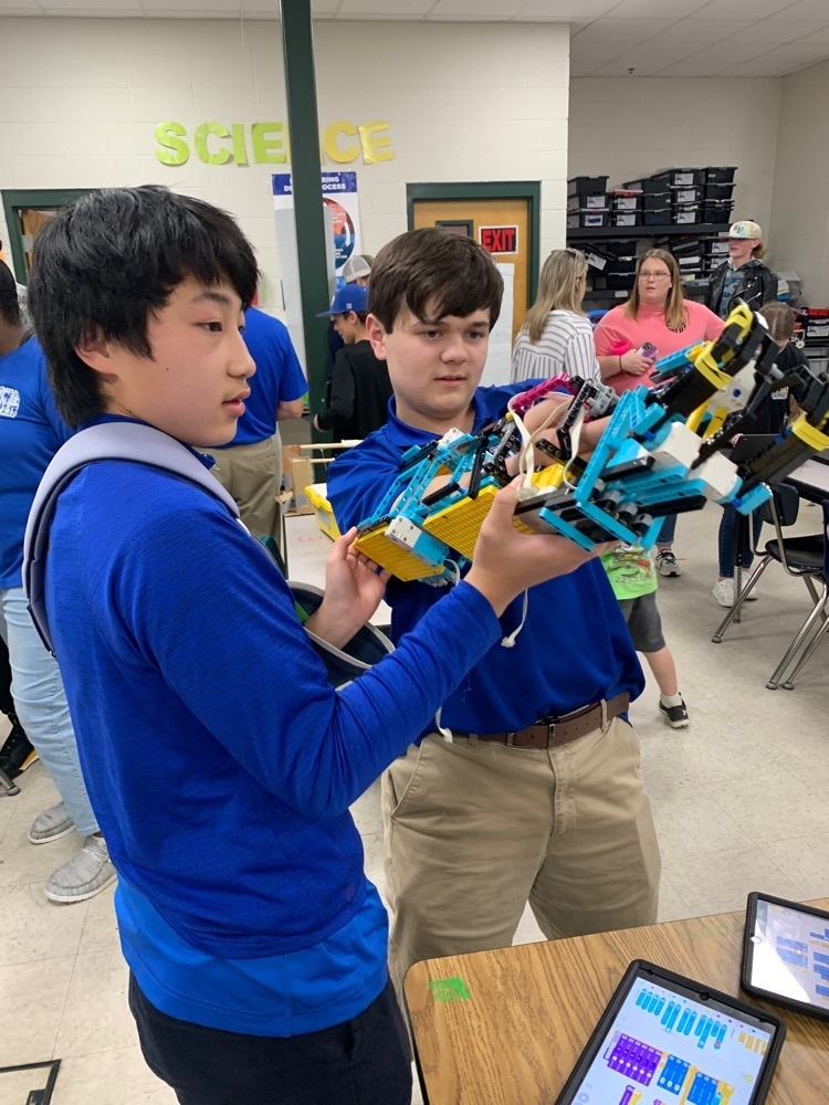Student shows off robotic arm